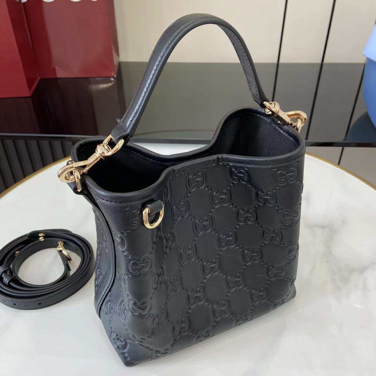 Gucci GG Emblem Small Bucket Bag GG Print Embossed Leather - Black
