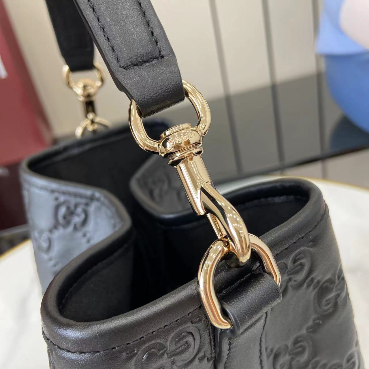 Gucci GG Emblem Small Bucket Bag GG Print Embossed Leather - Black