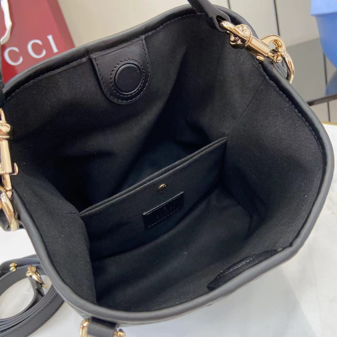 Gucci GG Emblem Small Bucket Bag GG Print Embossed Leather - Black