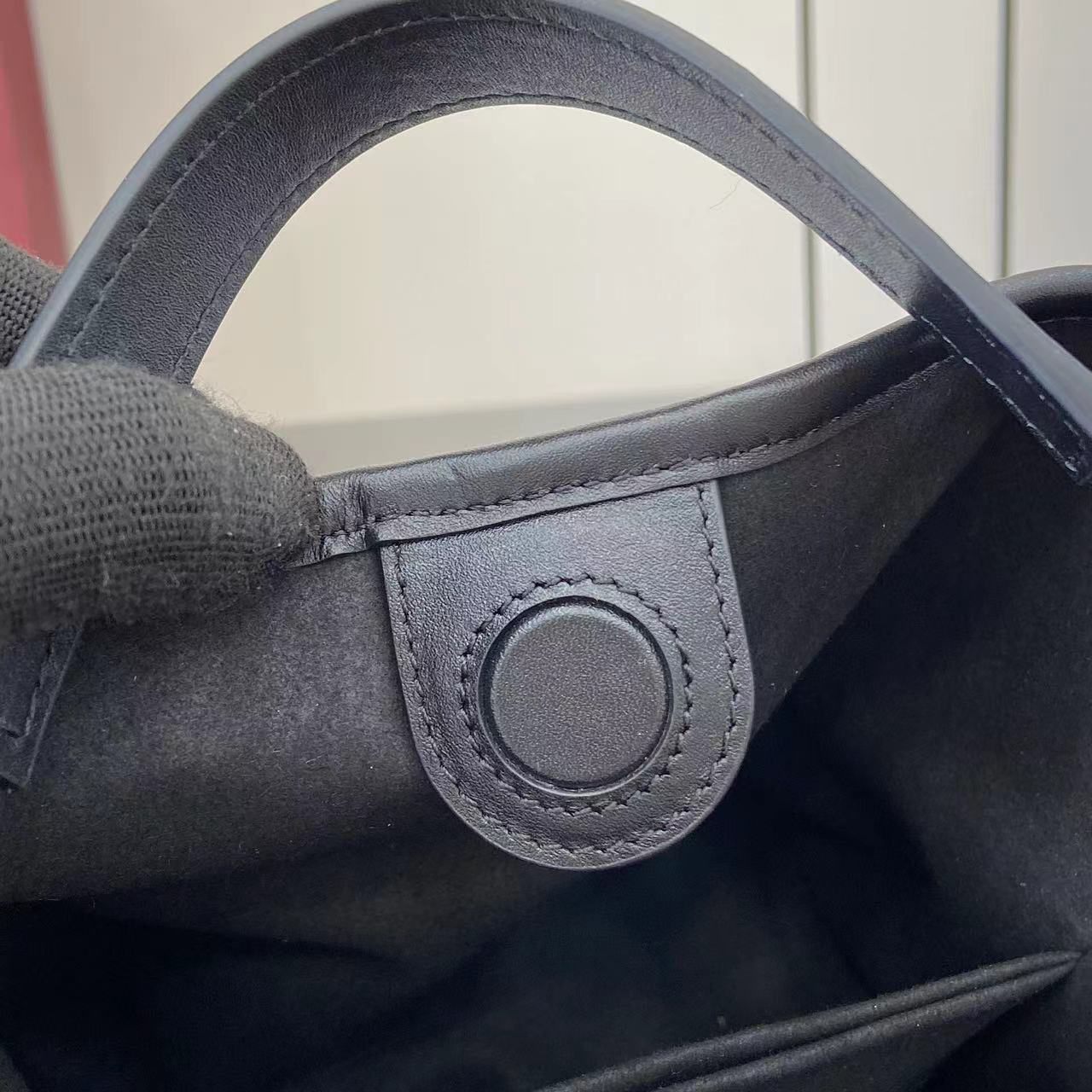 Gucci GG Emblem Small Bucket Bag GG Print Embossed Leather - Black