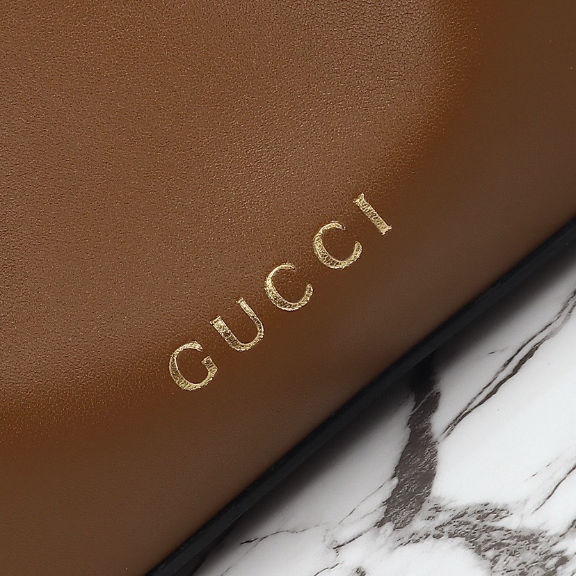 Gucci GG Emblem Mini Bucket Bag - Brown