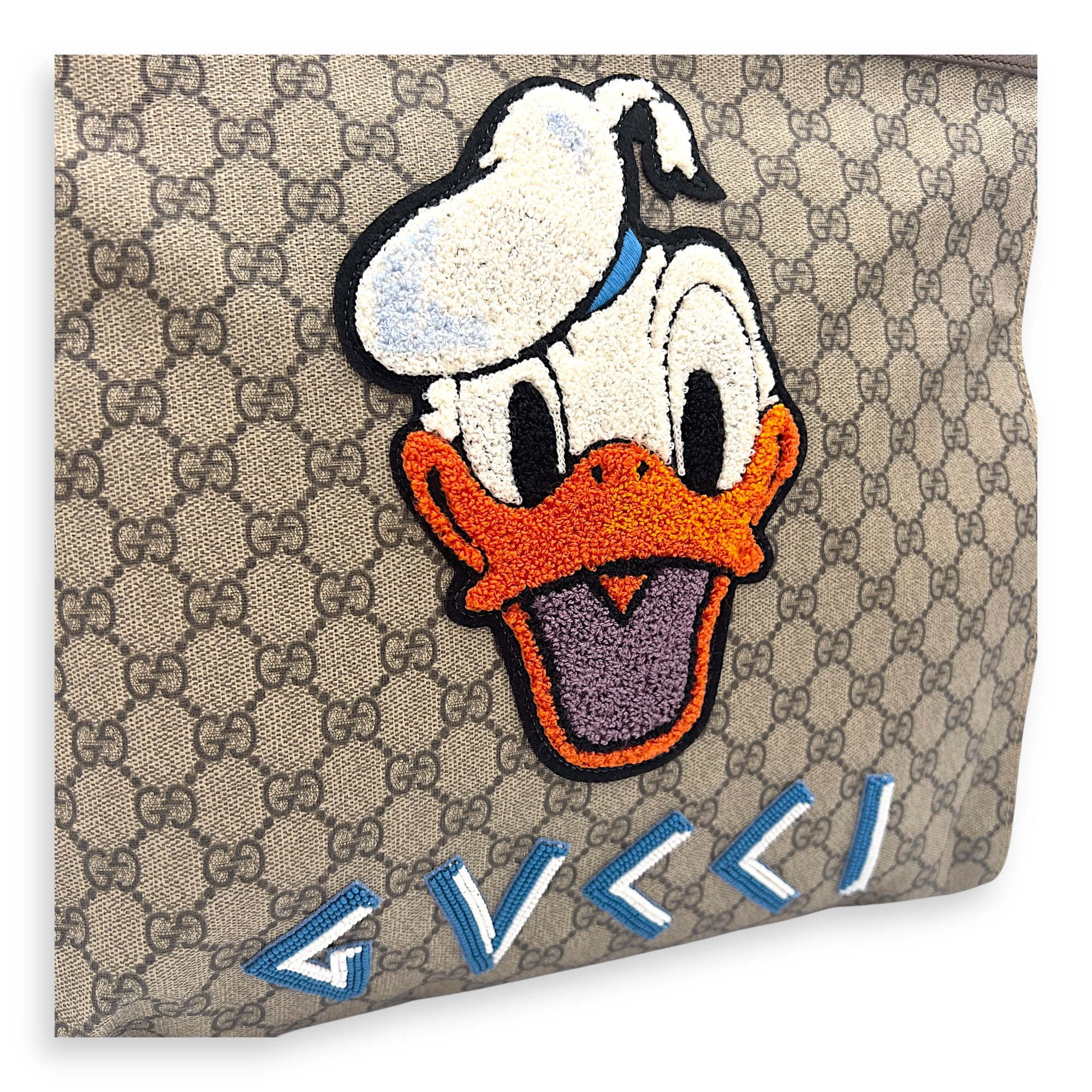 X Disney Donald Duck Soft GG Supreme Brown Top Handle Bag in Monogram Coated Canvas, Gold hardware