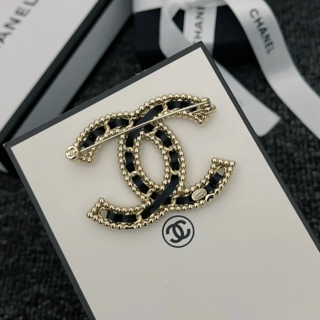 CC brooch pines