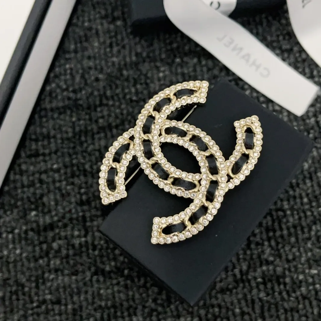 CC brooch pines