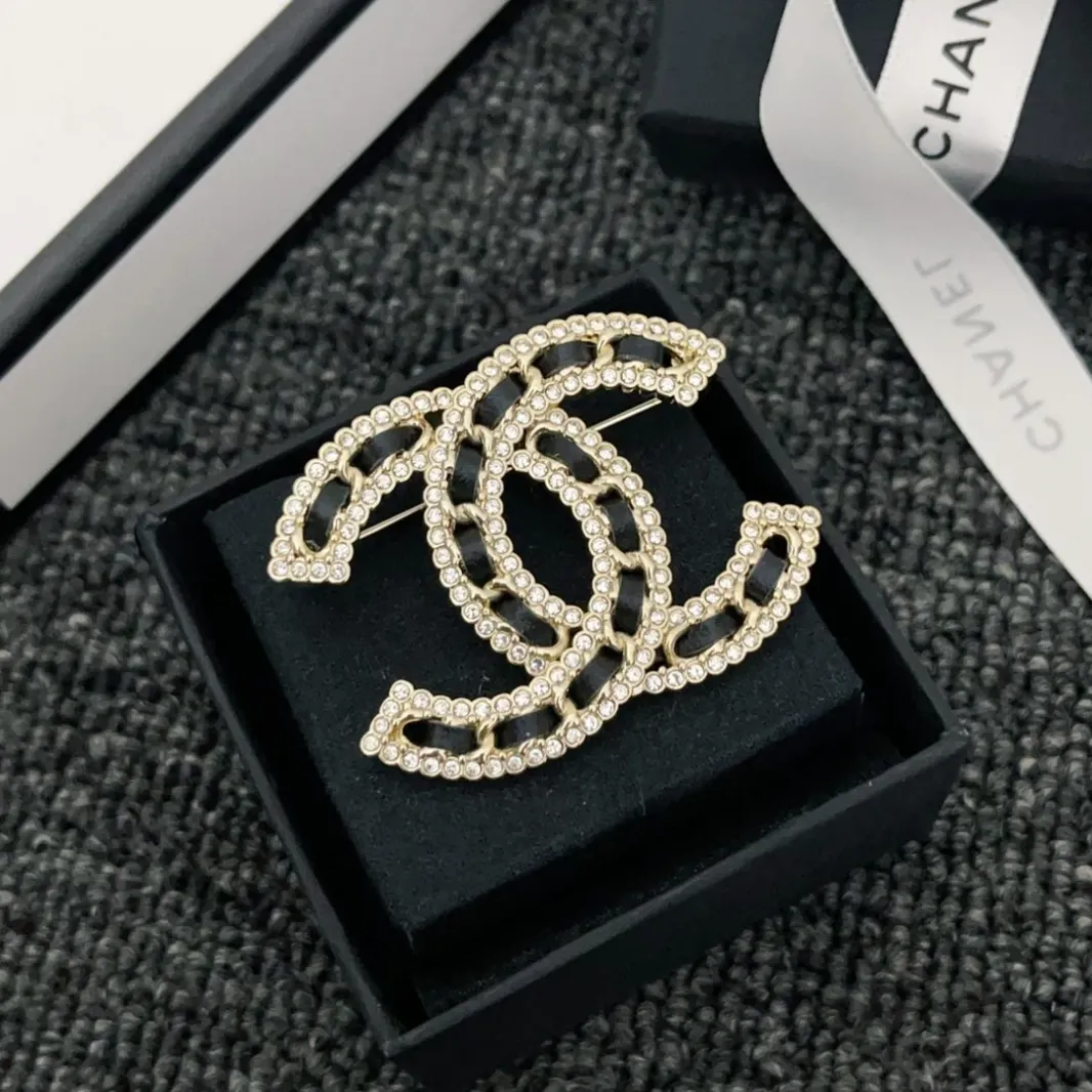 CC brooch pines